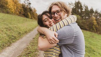 A man and woman happily hugging